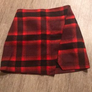 Red and black plaid mini skirt with a slit detail